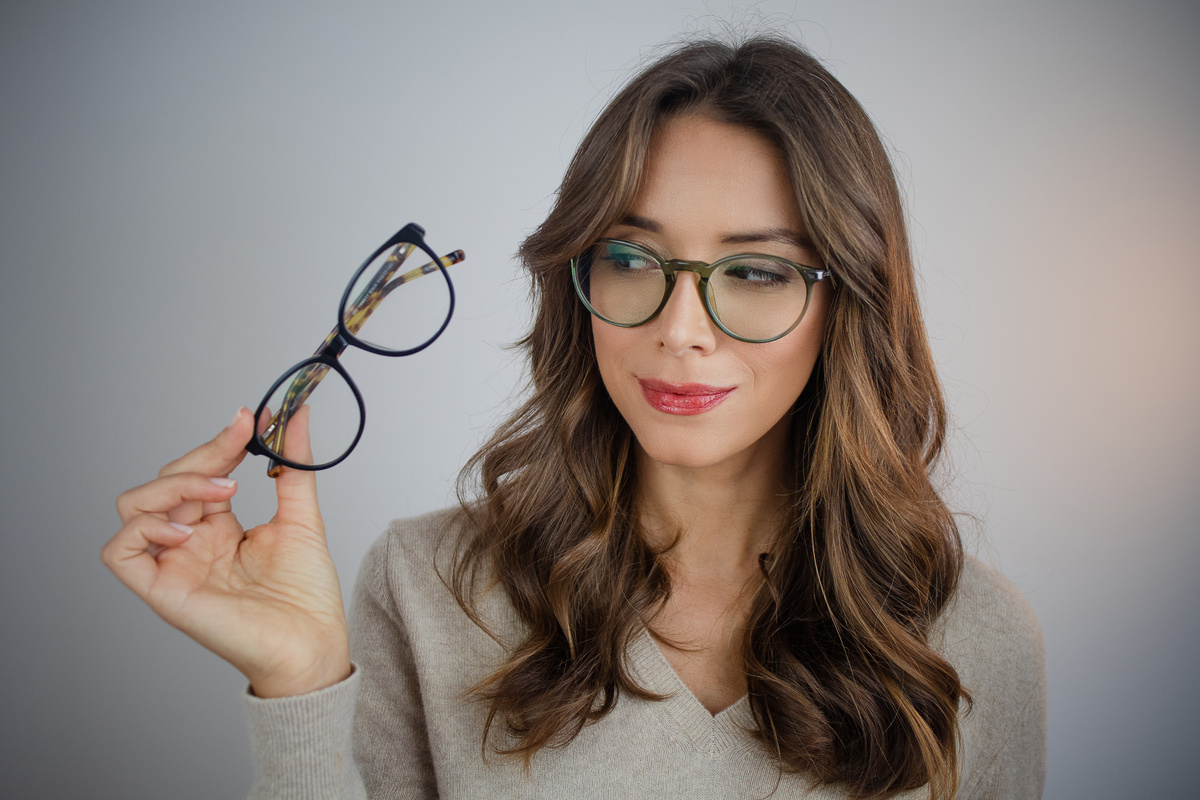 Woman Choosing Eyeglasses